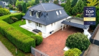 hausansicht drohne - Repräsentatives Viebrockhaus mit Mansarddach, Doppelcarport & Wohlfühl-Garten in Seevetal-Horst