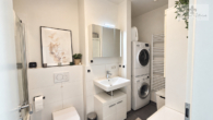 badezimmer - Über den Dächern von Stelle – moderne 3-Zimmer-Wohnung mit Weitblick bis Hamburg